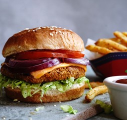 Homemade Veggie Burger with tender Jackfruit with side fries, selective focus