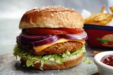 Homemade Veggie Burger with tender Jackfruit with side fries, selective focus