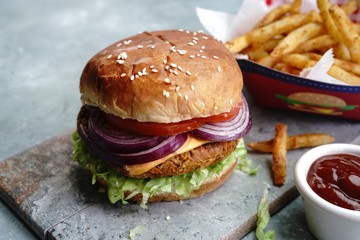 Homemade Veggie Burger with tender Jackfruit with side fries, selective focus