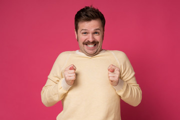 Caucasian funny man finger fig gesture you are going to get nothing.