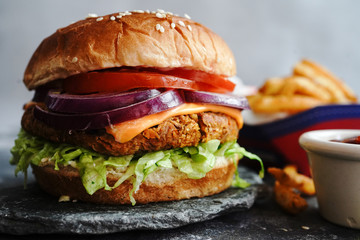 Homemade Veggie Burger with tender Jackfruit with side fries, selective focus