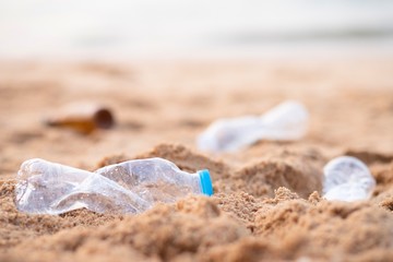 Fototapeta na wymiar Empty used plastic bottles on the beach.