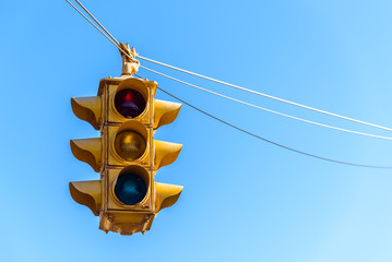 American traffic light, set against a blue summer sky