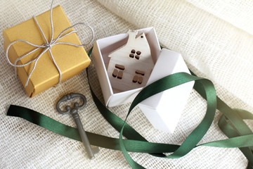 one of the gifts with the layout of the house inside on the table top view. ready-made real estate...