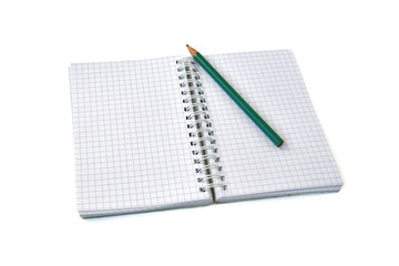 Squared notebook with pencil on isolate white background
