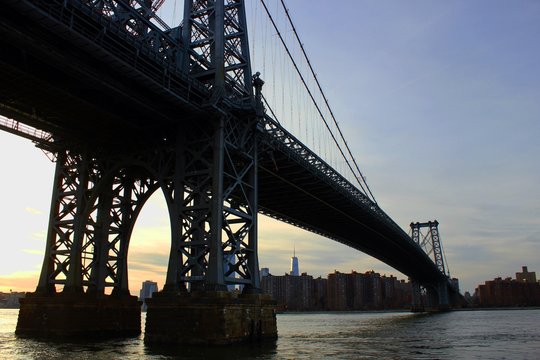 New york, USA - 20/12/2019: williamsburg bridge in New York Manhattan skyscrapers behind at sunset - stock photo