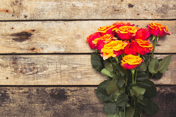 Bouquet of roses on wooden background