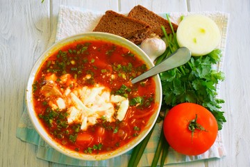 Sour borsch with a chapel, bacon and sour cream