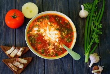 Sour borsch with a chapel, bacon and sour cream