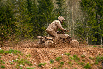 Quad bike in mud. ATV Rider in the action.