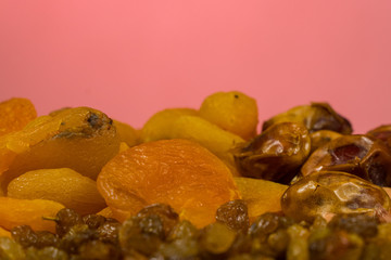background of mixture of nuts and raisins, closeup