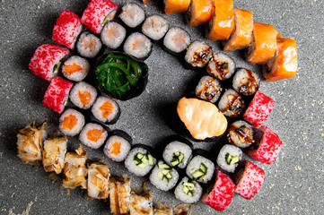Set of various rolls and sushi. Gunkan in the center. Baked rolls. View from above