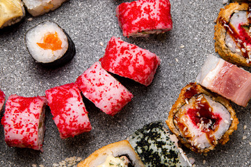 Sushi with red and black caviar. Baked rolls.