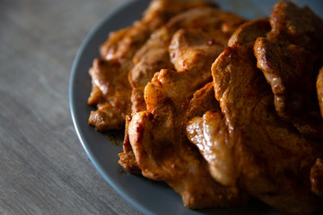 marinated pork slices on a plate