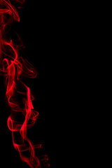 Red smoke on black background