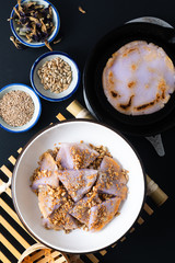 Healthy food concept Vegan Gluten free Homemade Asian fried glutinous rice flat pancake with sesame and sunflower seeds on black baclground with copy space