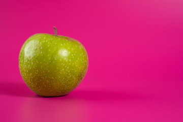 sour green apple on background