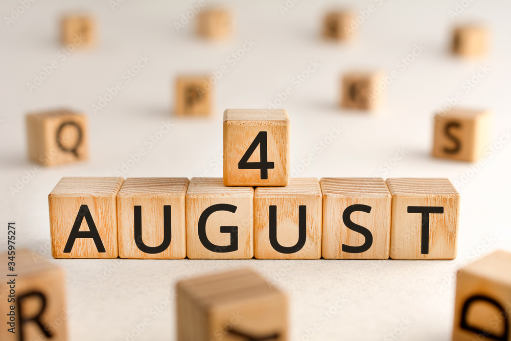 Poster august 4 - from wooden blocks with letters, important date concept, white background random letters 