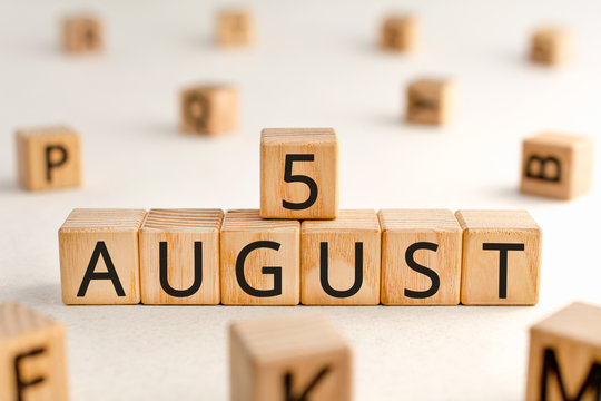 August 5 - from wooden blocks with letters, important date concept, white background random letters around