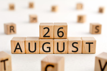 August 26 - from wooden blocks with letters, important date concept, white background random letters around