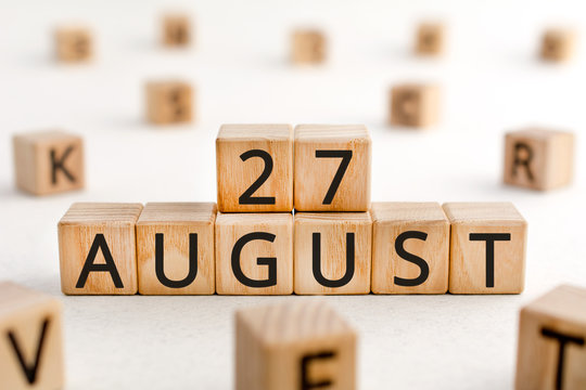 August 27 - from wooden blocks with letters, important date concept, white background random letters around