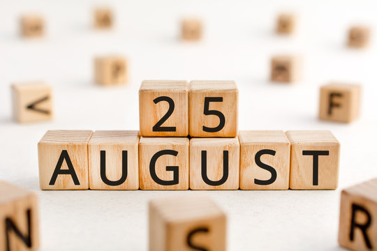 August 25 - from wooden blocks with letters, important date concept, white background random letters around