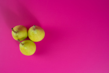 green pears on background