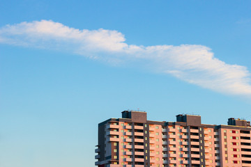 clouds at sunset over the rooftops buildings cityscape