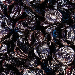 Prunes Macro. texture dry prunes closeup, food background.