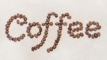 the word coffee is made of coffee beans fonts. On a white background. copy space word  coffee