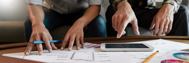 Creative team analyzing prototype products for product design in Coworking Space, teamwork collaboration concept.