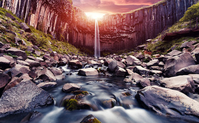 The Incredible landscape of  Skaftafell waterfall  in North-Iceland with colorful sky during...