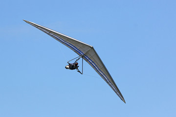 Fototapeta na wymiar Hang Glider in a blue sky