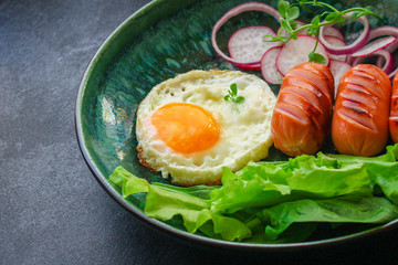 healthy breakfast, fried eggs sausages and vegetables Menu concept. food background. top view copy space for text keto or paleo diets