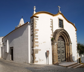Saint Peters church facade under a blue sky at Elvas