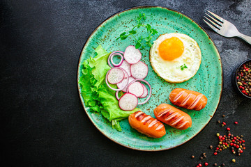healthy breakfast, fried eggs sausages and vegetables Menu concept. food background. top view copy space for text keto or paleo diets