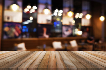 Naklejka na ściany i meble wooden table with abstract blurred background resturant lights used for display montage products mock up design.