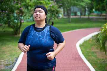 Fototapeta premium asian fat woman running