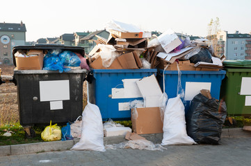 Overloaded garbage containers in the city