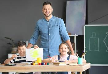 Drawing teacher giving optional classes at school