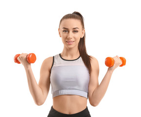 Sporty young woman with dumbbells on white background