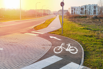 Bike path and sidewalk at sunset