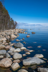 Stones in clear blue lake water. Lake Ladoga, Russia.