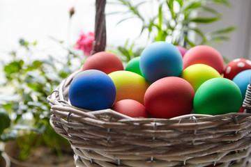 Fototapeta na wymiar Easter Day, basket with colorful Easter Eggs