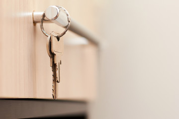 Close-up of metal keys and keychain at home and in the office. Security concept against hacking of apartments and apartments