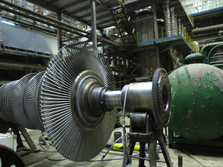 Power generator steam turbine in repair process, machinery, pipes, tubes at power plant