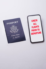 Travel warning on a cell phone with a passport for international travel