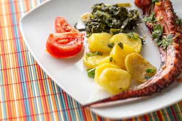 Squid leg with potatoes and turnip greens ready to eat, Braga, Portugal.
