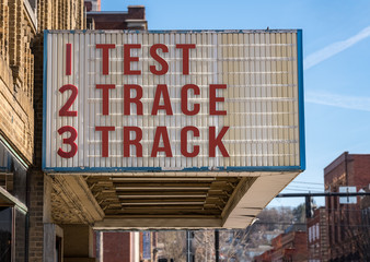 Mockup of movie cinema billboard with Test, Trace, Track message to control the coronavirus epidemic once economy opens up