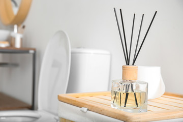 Reed diffuser in modern bathroom